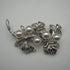 Broche vintage de plata con forma de rama y decoración de perlas