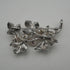 Broche vintage de plata con forma de rama y decoración de perlas