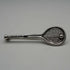 Broche antiguo de plata en forma de raqueta de tenis
