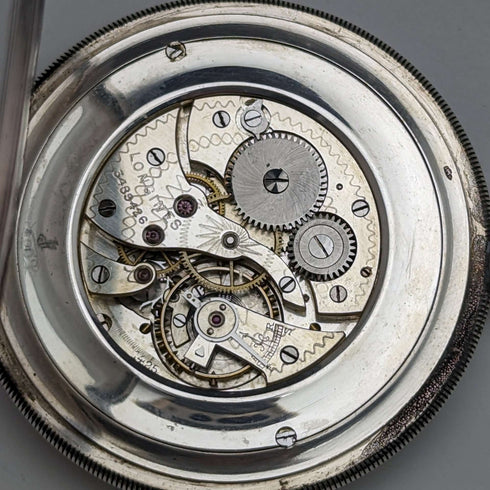 Reloj de bolsillo Longines antiguo, circa 1916, caja de plata delgada de cara abierta, en buen estado de funcionamiento