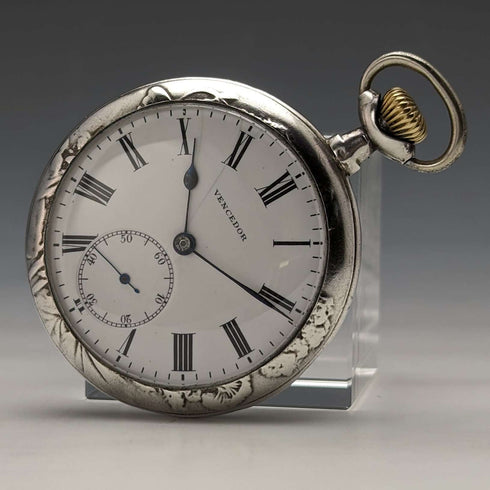 Reloj de bolsillo suizo antiguo Vencedor de principios del siglo XX, caja de plata con grabado de mariposa, en buen estado de funcionamiento.