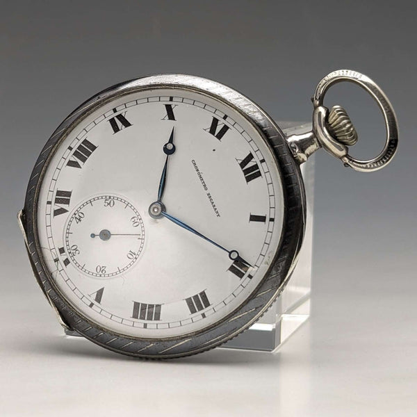 Reloj de bolsillo suizo antiguo, circa 1920, marca Escasany, caja delgada de plata con decoración de niel, en buen estado de funcionamiento.