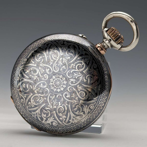 Reloj de bolsillo Longines antiguo, circa 1890, caja de plata con niello detallado, en buen estado de funcionamiento