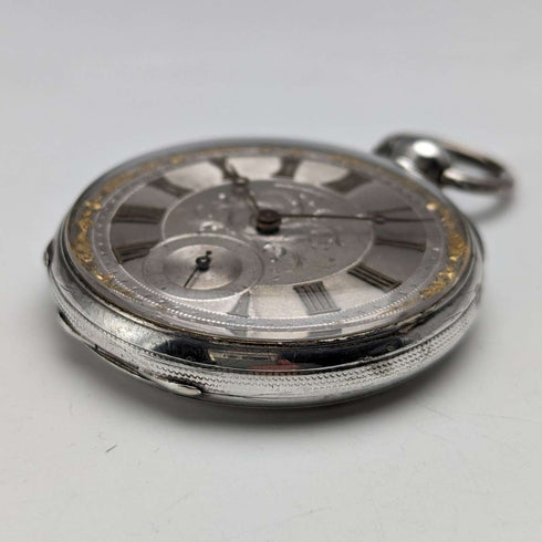 Reloj de bolsillo antiguo Bauer de hacia 1880, esfera decorada, carga por llave, caja de plata, diámetro 44 mm, en funcionamiento, con defectos.