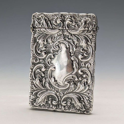 Antique American sterling silver card case with embossed decoration, 75g