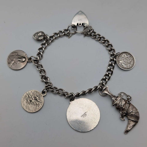 Pulsera de dijes de plata esterlina, vintage, de origen británico, circa 1970, 40 g