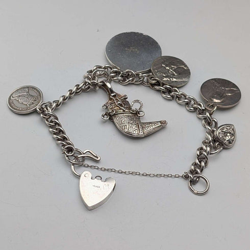 Pulsera de dijes de plata esterlina, vintage, de origen británico, circa 1970, 40 g