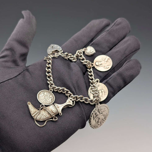 Pulsera de dijes de plata esterlina, vintage, de origen británico, circa 1970, 40 g