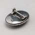 Vintage British sterling silver oval brooch featuring two women with butterfly wings