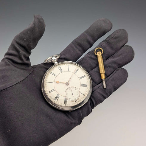 1881 British antique John Cowgill sterling silver pocket watch with key winding mechanism, 53mm diameter, in good working order