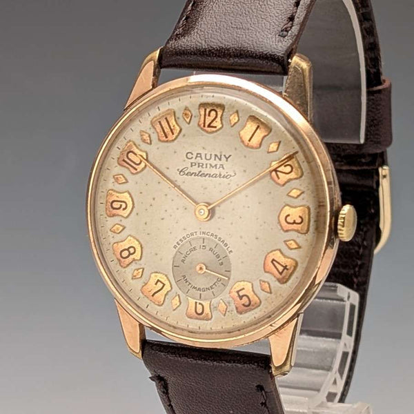 Reloj de pulsera para caballero Cauny su izo de la década de 1950, 15 rubíes, mecánico, caja chapada en oro, en buen estado de funcionamiento.