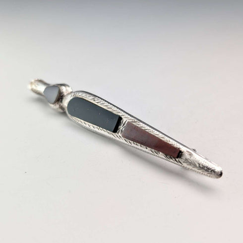 Antique British sterling silver brooch with three colored stones and a Scottish dark finish.