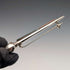 Antique British sterling silver brooch with three colored stones and a Scottish dark finish.