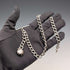 Cadena Albert de plata esterlina antigua inglesa de circa 1897, 46 g, con charm fob de nácar