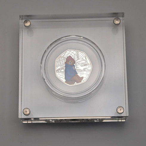 Moneda conmemorativa de plata de 50 peniques del 60.º aniversario de "Paddington Bear" del Reino Unido, con estuche y certificado de la Royal Mint