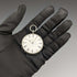 Reloj de bolsillo antiguo para dama, de fabricación suiza, en buen estado de funcionamiento, con caja de plata con grabado floral y cuerda por llave.