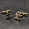 Gemelos de plata de ley (sterling silver) fabricados en el Reino Unido con baño de oro y diseño de libra esterlina